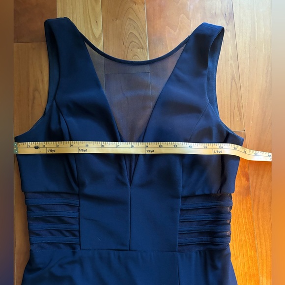 Navy blue fully lined ballgown with cutouts covered with navy, sheer mesh. - Picture 6 of 11